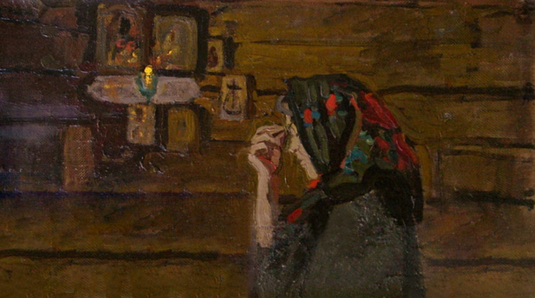 Молится у икон