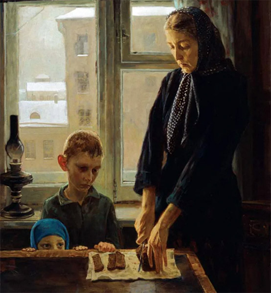 Мать режет хлеб